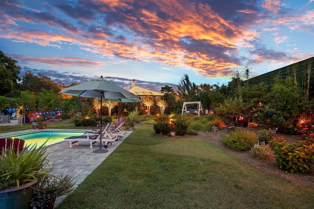 view of yard with a patio area and an outdoor pool