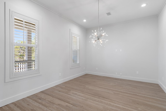 unfurnished room featuring crown molding, plenty of natural light, and baseboards