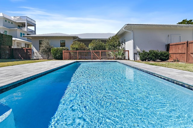 view of swimming pool with fence and a fenced in pool