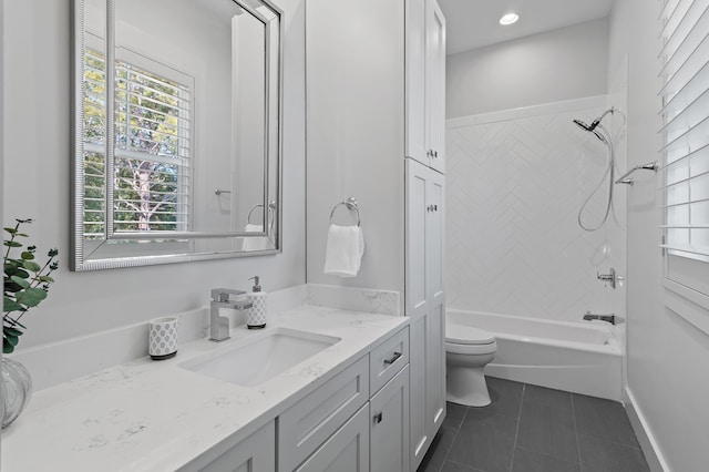 full bathroom featuring toilet, vanity, baseboards, shower / bathing tub combination, and tile patterned floors