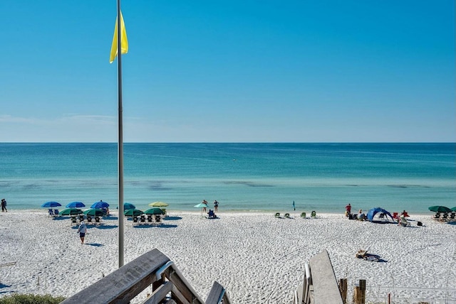 property view of water featuring a beach view