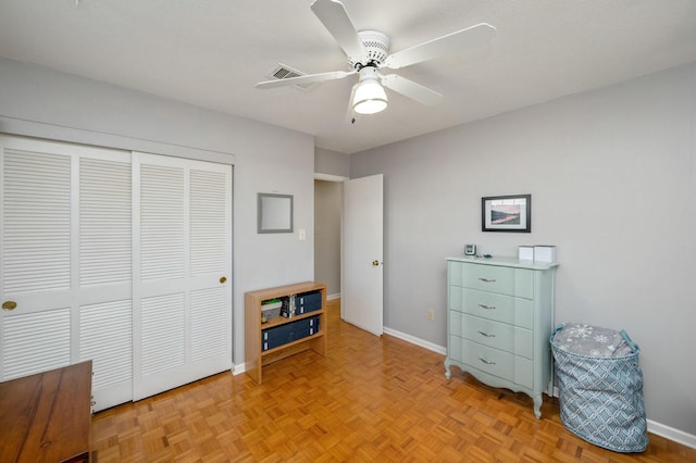 interior space featuring a ceiling fan, a closet, and baseboards