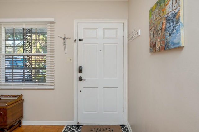 entryway featuring baseboards