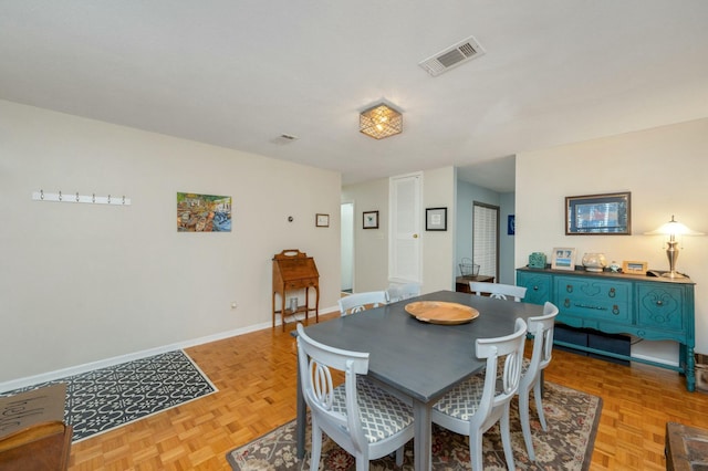 dining area featuring baseboards and visible vents