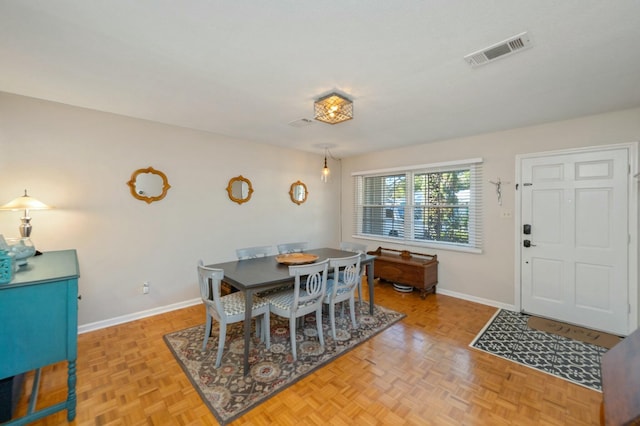 dining room featuring baseboards and visible vents