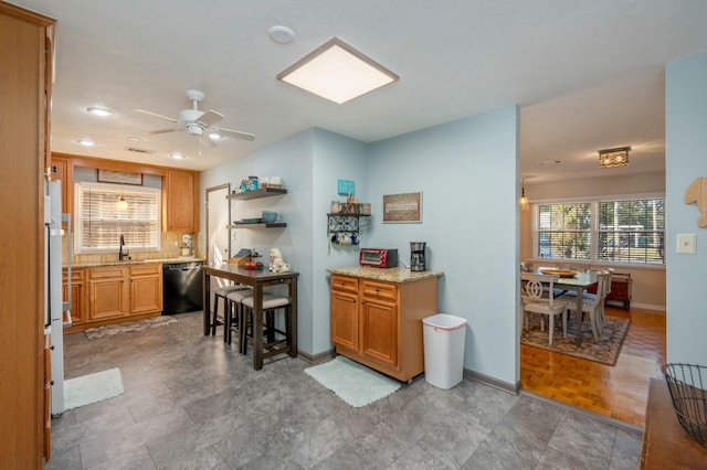 kitchen featuring baseboards, brown cabinetry, dishwasher, open shelves, and a sink