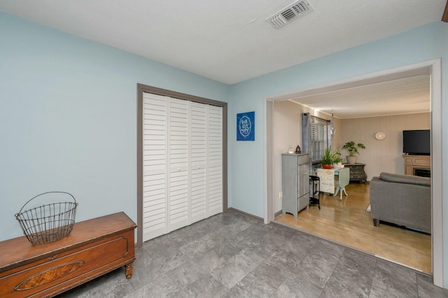 interior space featuring visible vents, a fireplace, and baseboards