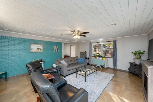 living room featuring brick wall, concrete floors, visible vents, and ceiling fan