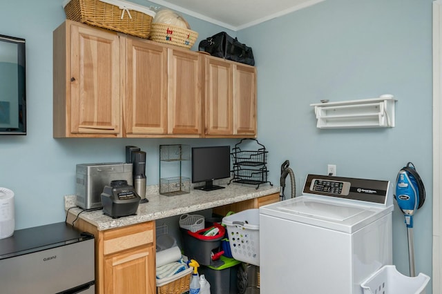 laundry room featuring cabinet space, washer / clothes dryer, and crown molding