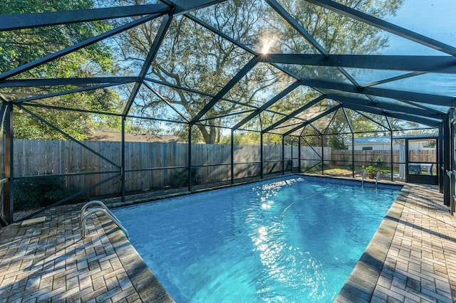 view of swimming pool featuring a fenced backyard, a patio area, a lanai, and a fenced in pool