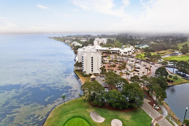 birds eye view of property featuring a water view and view of golf course