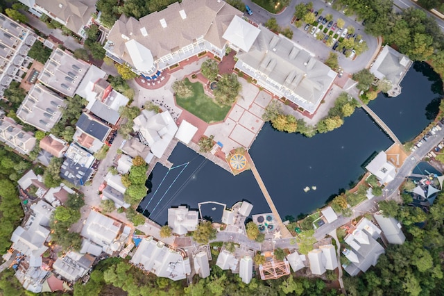 birds eye view of property featuring a water view and a residential view