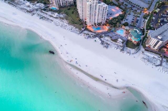 aerial view featuring a view of city, a beach view, and a water view