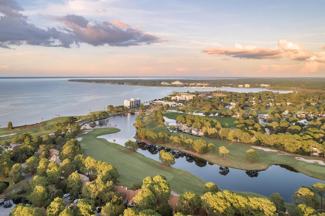 aerial view at dusk with a water view