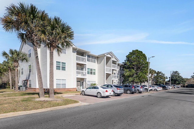 view of property with uncovered parking