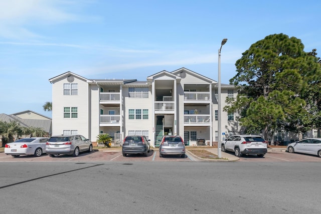 view of property with uncovered parking