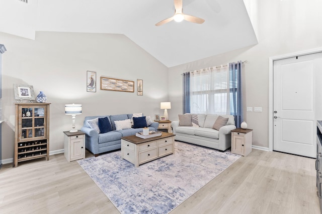 living room with lofted ceiling, baseboards, light wood-style flooring, and a ceiling fan