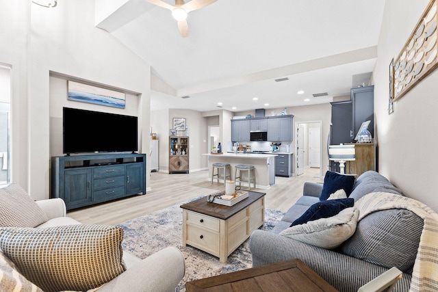 living area with recessed lighting, visible vents, light wood-style floors, a ceiling fan, and high vaulted ceiling