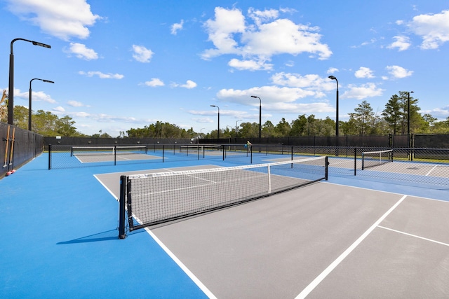 view of sport court with fence