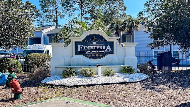 community sign featuring fence