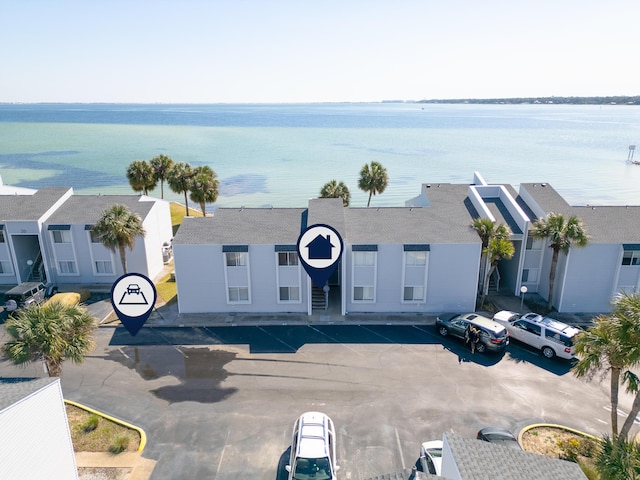 bird's eye view with a water view and a residential view