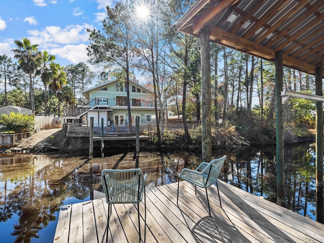 dock area with a water view