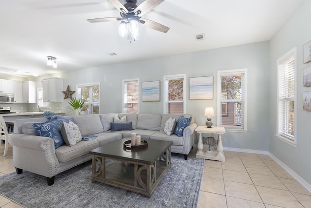 living area featuring a healthy amount of sunlight, visible vents, and light tile patterned flooring