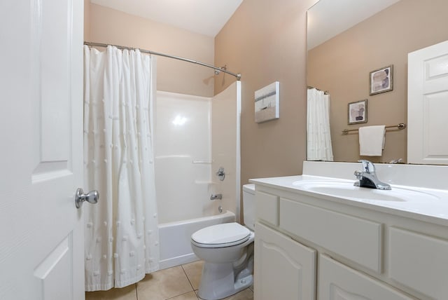 bathroom with toilet, vanity, shower / tub combo with curtain, and tile patterned floors