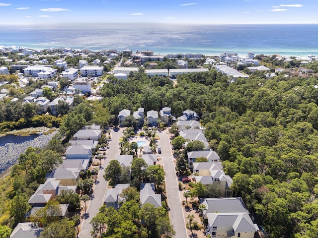 birds eye view of property with a water view and a residential view