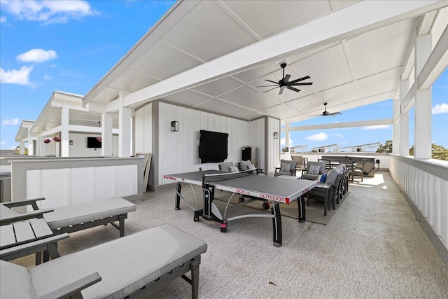 view of patio / terrace with an outdoor living space, a ceiling fan, and outdoor dining space