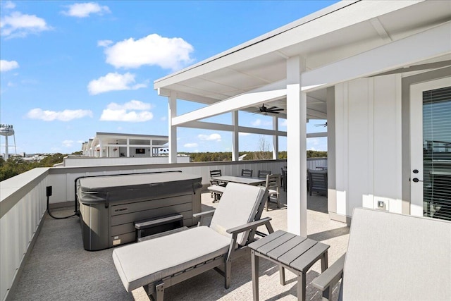 view of patio / terrace with a hot tub