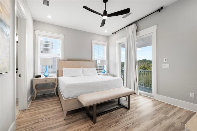 bedroom featuring light wood-type flooring, access to exterior, baseboards, and visible vents