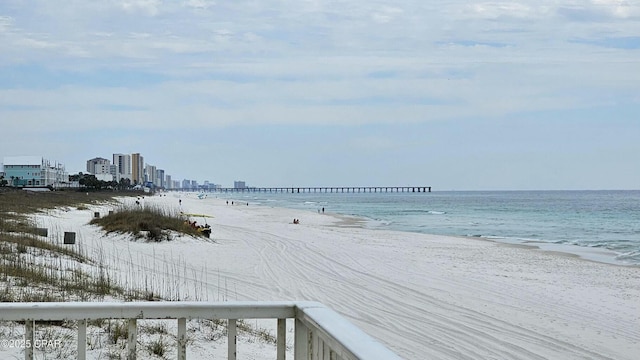 water view featuring a beach view and a city view