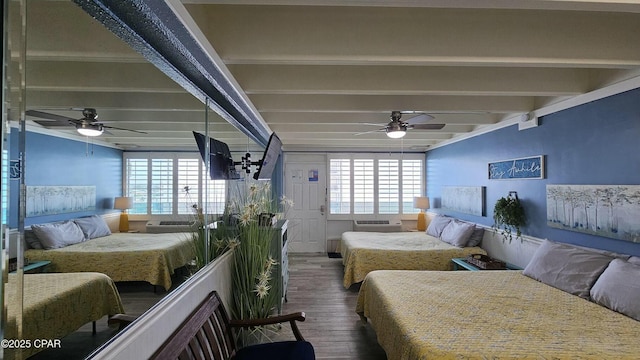 bedroom featuring ceiling fan, beam ceiling, and wood finished floors