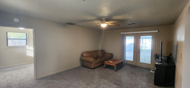 unfurnished room with carpet floors, baseboards, visible vents, and french doors