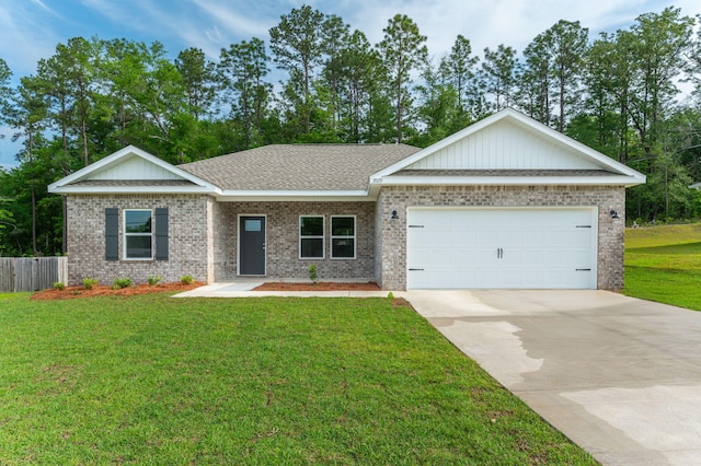 view of front facade with a garage, driveway, a front lawn, and brick siding
