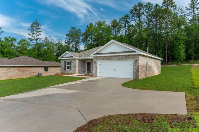 view of front of property featuring brick siding, an attached garage, driveway, and a front yard