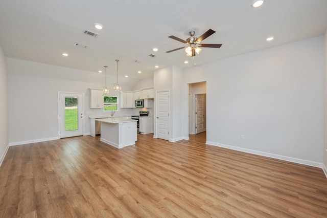 unfurnished living room with visible vents, recessed lighting, ceiling fan, and light wood-type flooring