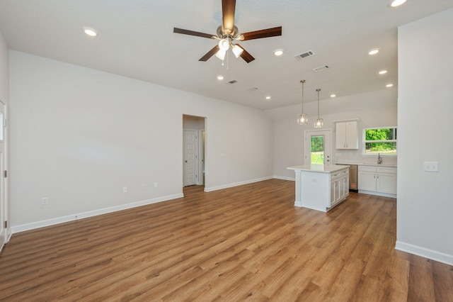 unfurnished living room featuring recessed lighting, ceiling fan, visible vents, and light wood-style floors