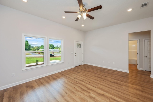 unfurnished room with baseboards and light wood finished floors