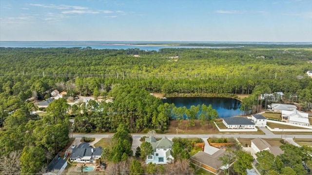 bird's eye view with a water view and a forest view