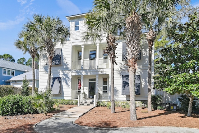 view of front facade with a porch and a balcony