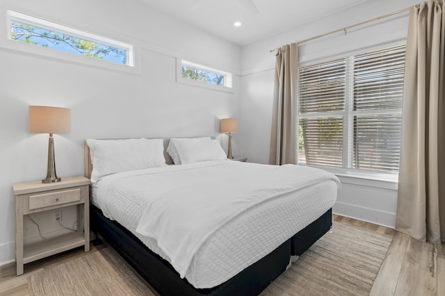 bedroom with recessed lighting, baseboards, ceiling fan, and light wood finished floors