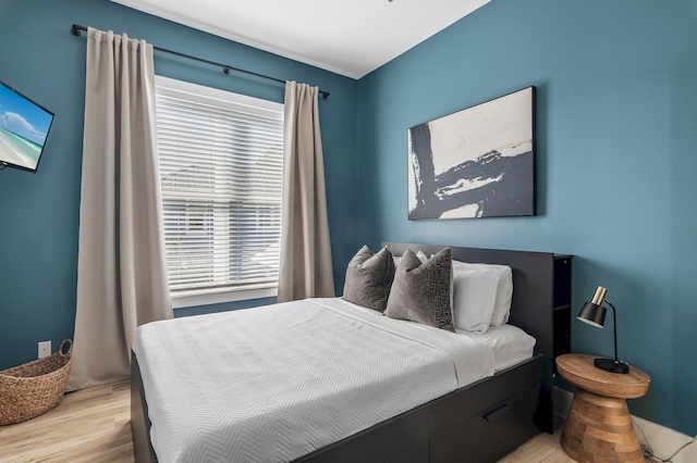 bedroom with light wood-style floors