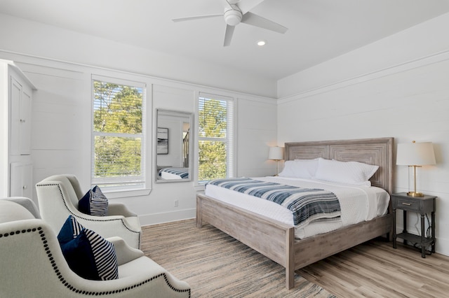 bedroom with a ceiling fan, recessed lighting, baseboards, and light wood finished floors