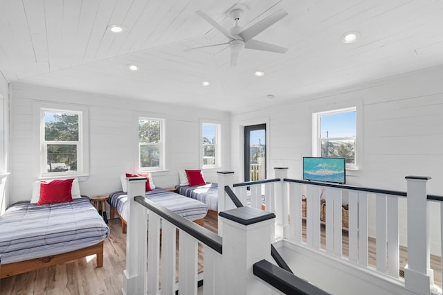 interior space featuring multiple windows, wooden ceiling, and wood finished floors