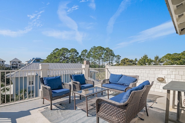 wooden terrace featuring an outdoor hangout area