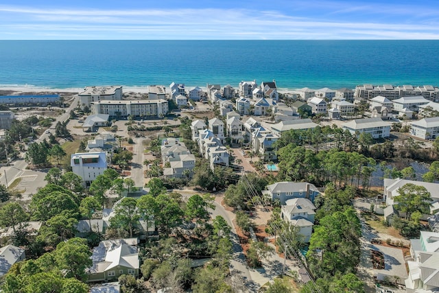 birds eye view of property with a water view and a residential view