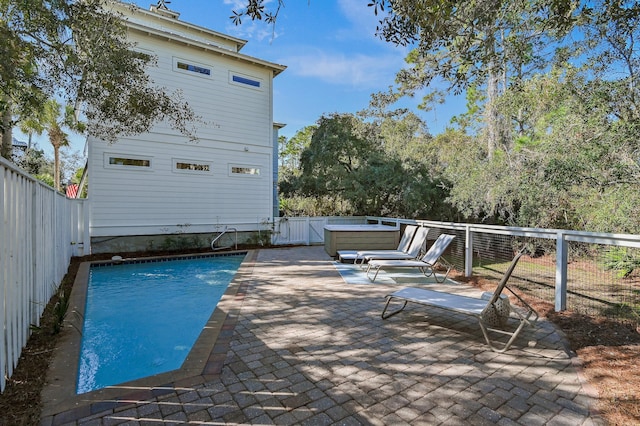 view of swimming pool featuring a patio area and a fenced backyard