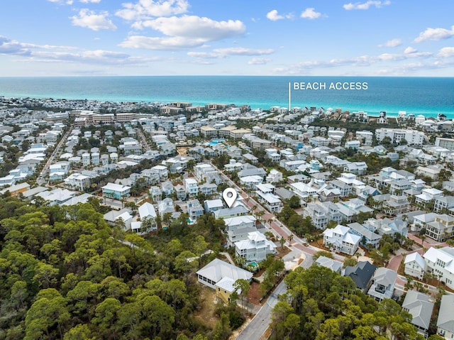 birds eye view of property featuring a water view and a residential view